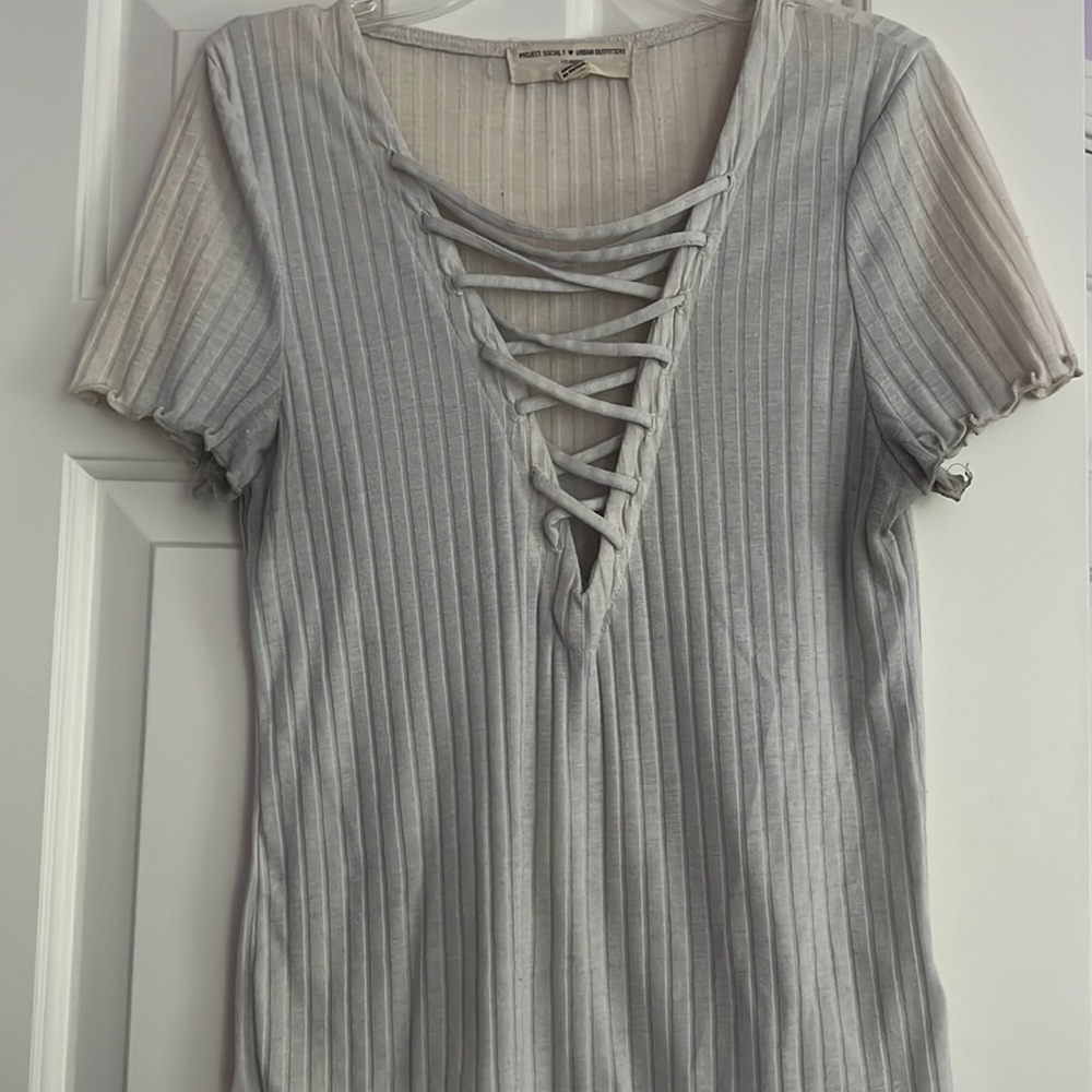 Project Social T + Urban Outfitters cream t-shirt with lace up front detail!
